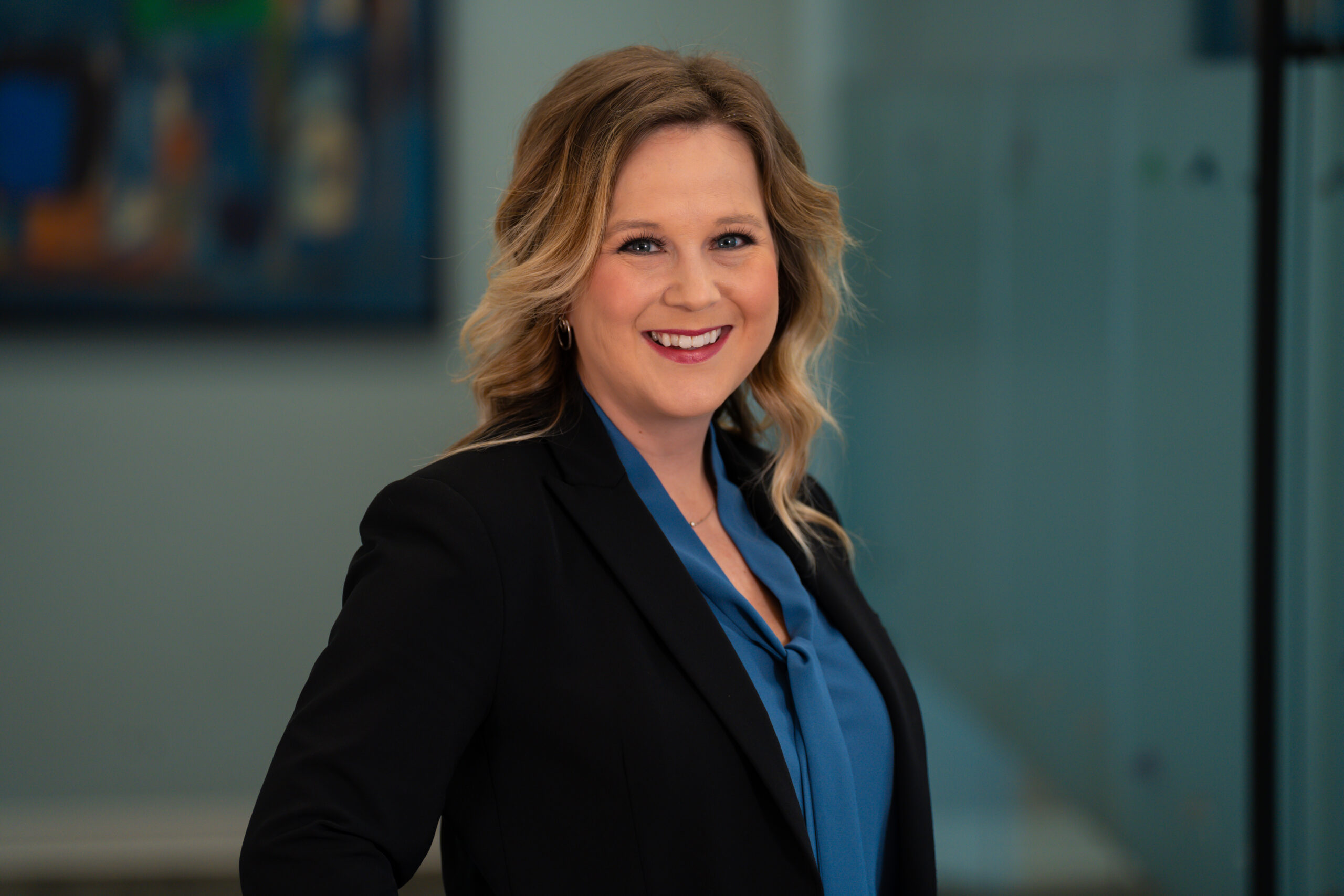 Brooke Pauley, CPA, CEO and Co-Founder of Horsepower Today headshot in office