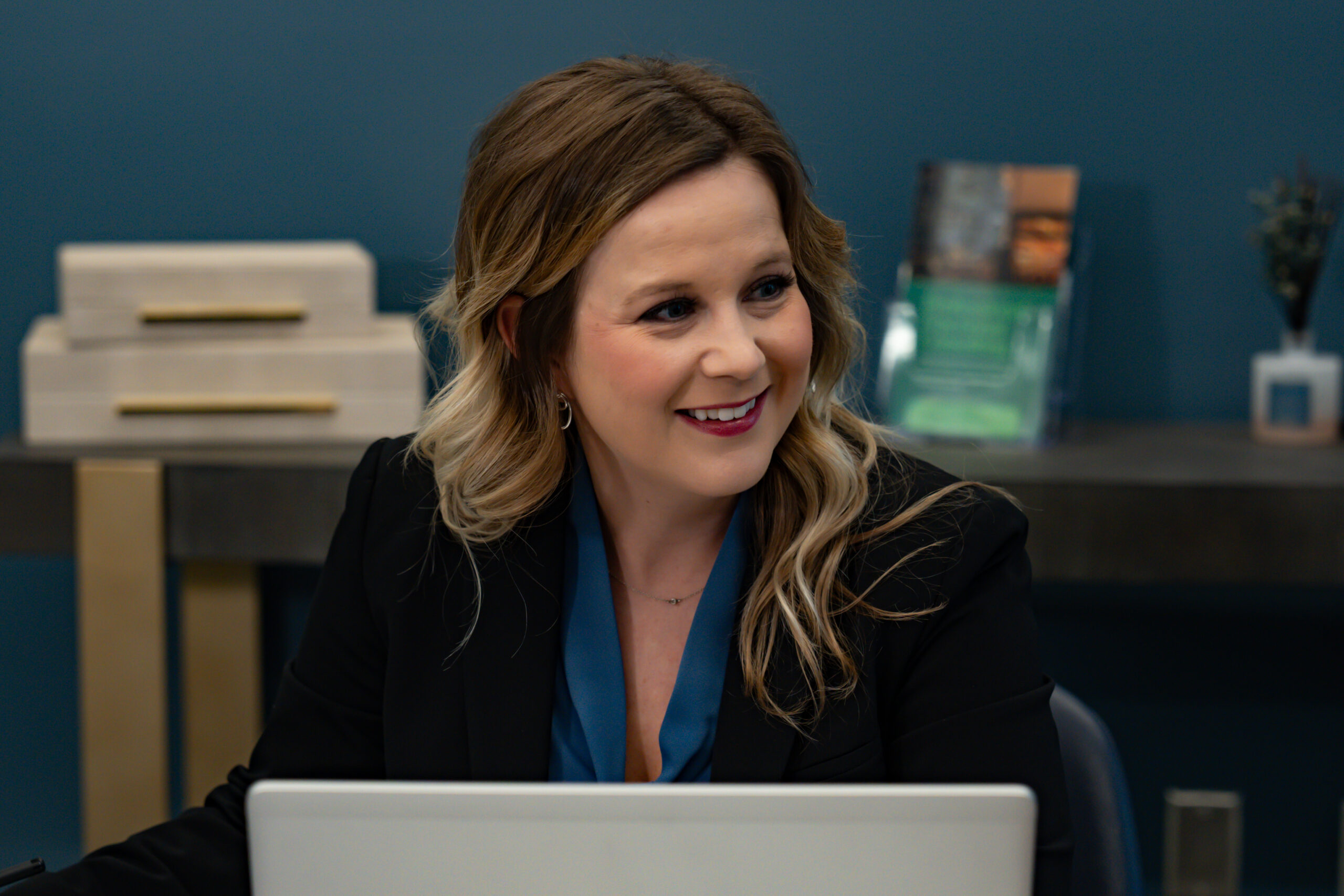 Brooke Pauley CFO, CEO and Co-Founder of Horsepower Today in Omaha Nebraska working at a computer