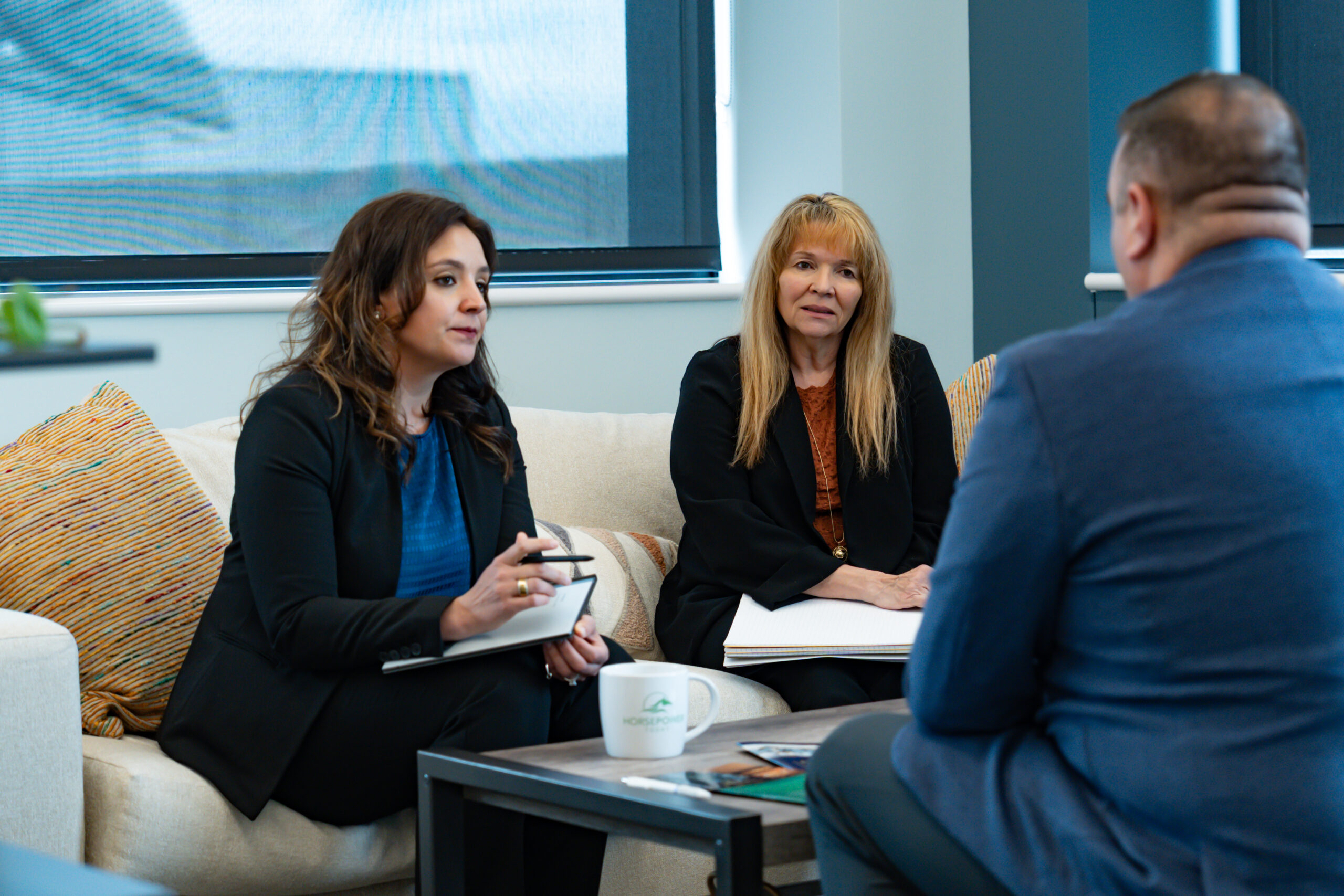 Hollie-James-Cinda-Horsepower Today team meeting Horsepower Today team in Omaha Nebraska meeting over coffee table